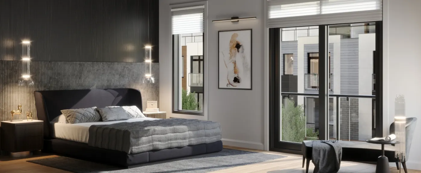 Primary bedroom with an upholstered bed, fluted feature wall and floor-to-ceiling glass doors opening to a Juliet balcony.