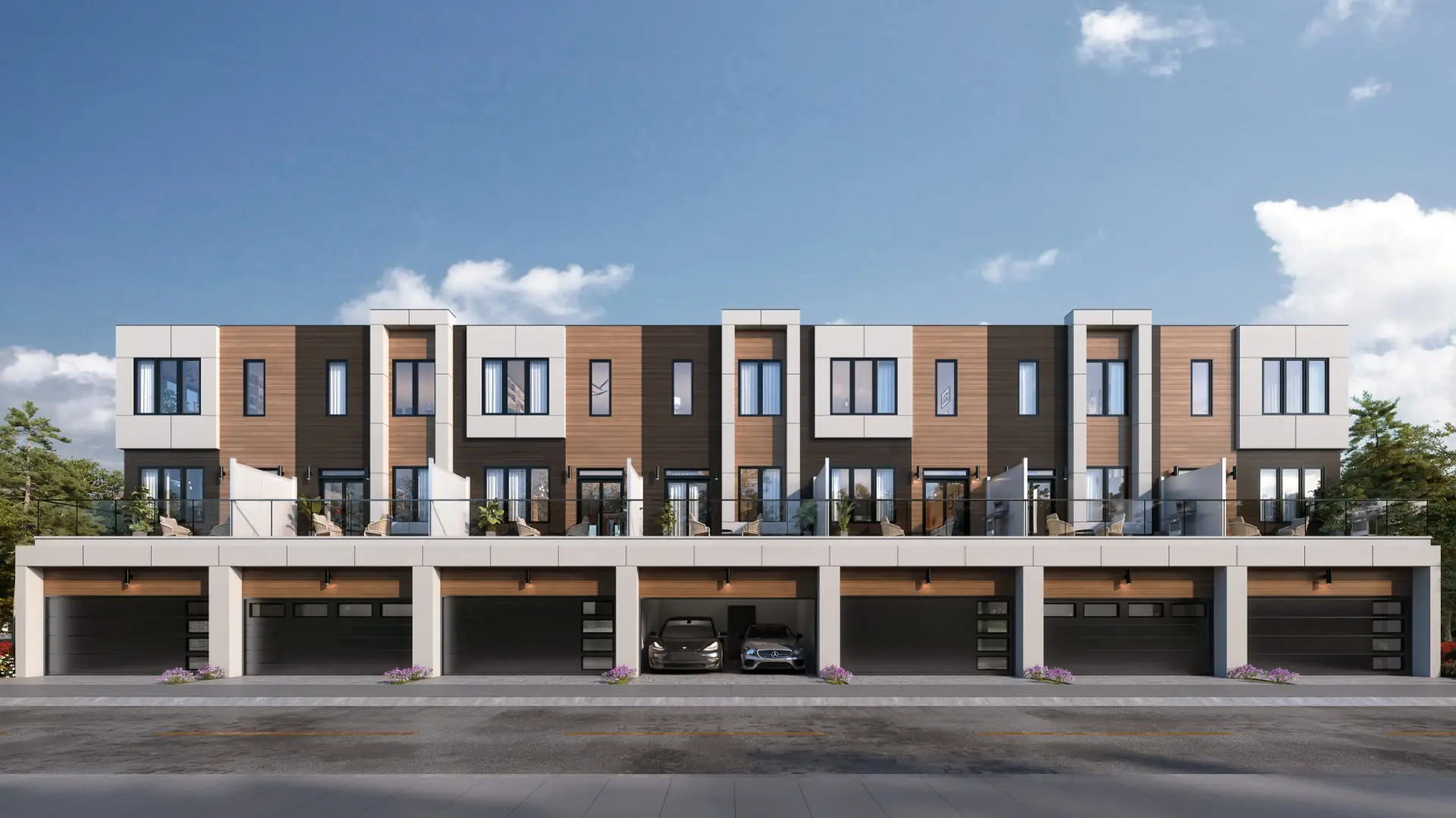 Rear elevation of a QASA Collection block — double car garages at grade with furnished terraces on the level above.